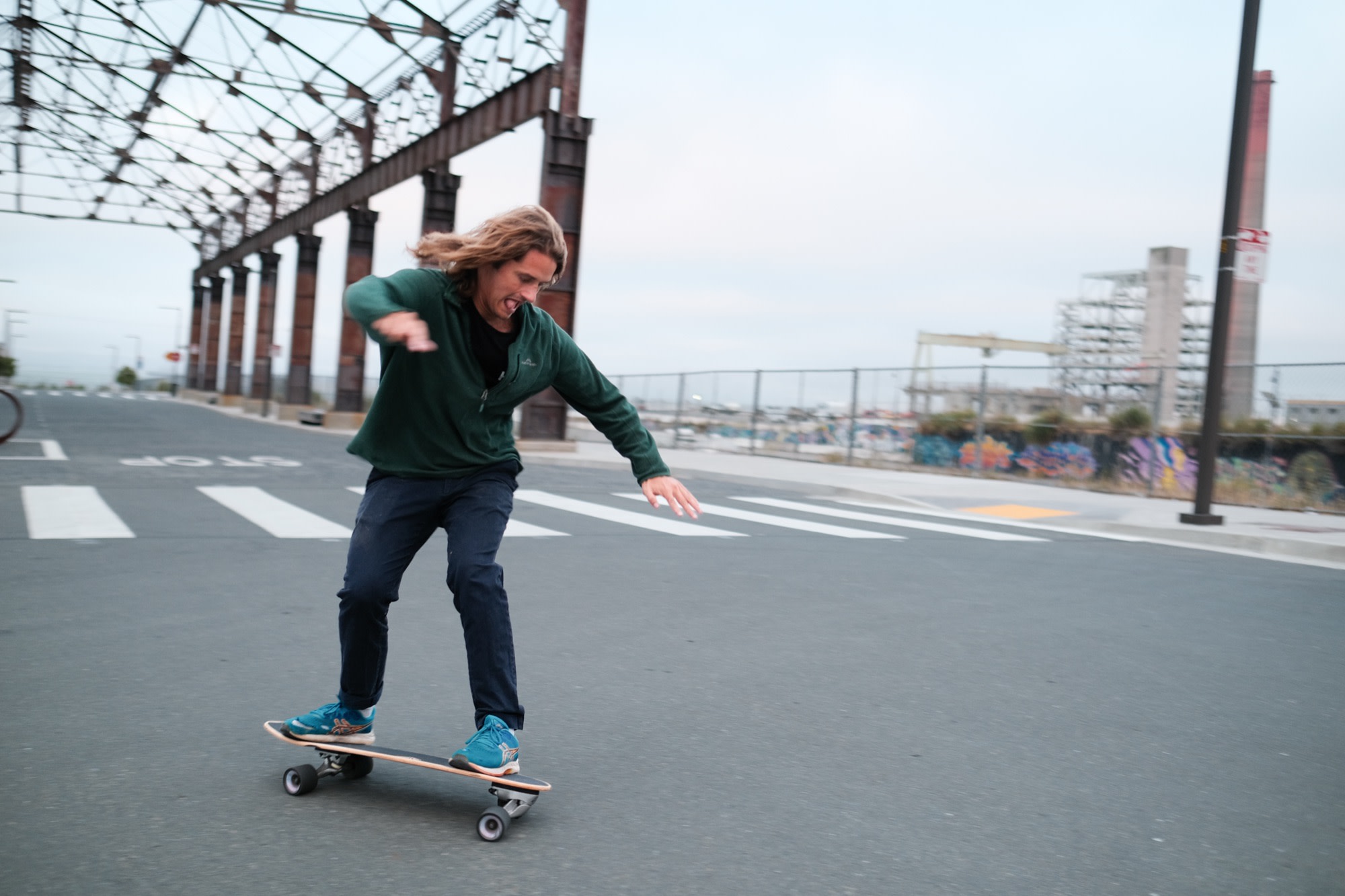 Laurence skating, arms out for balance