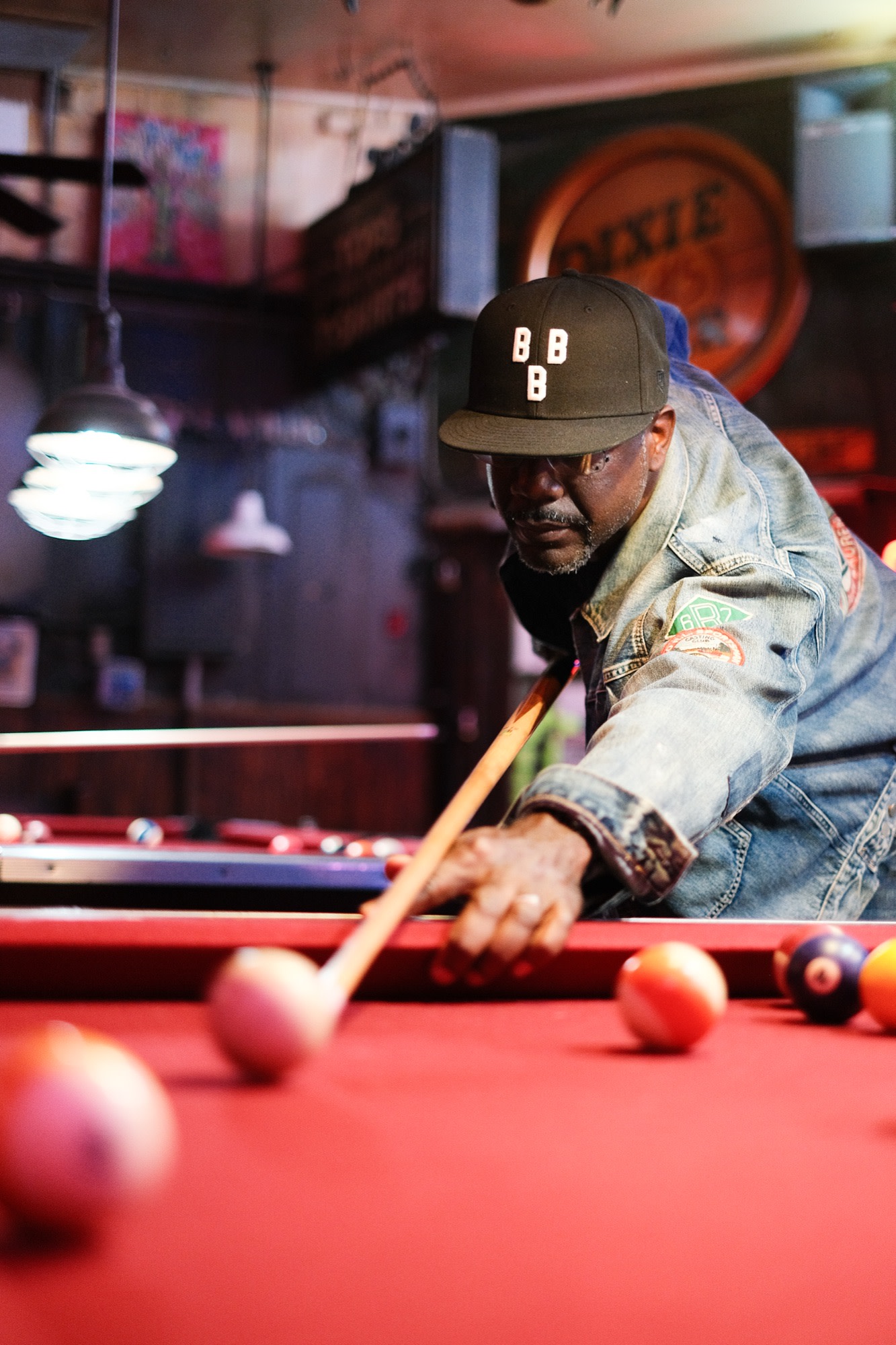Lining up a shot at the pool table