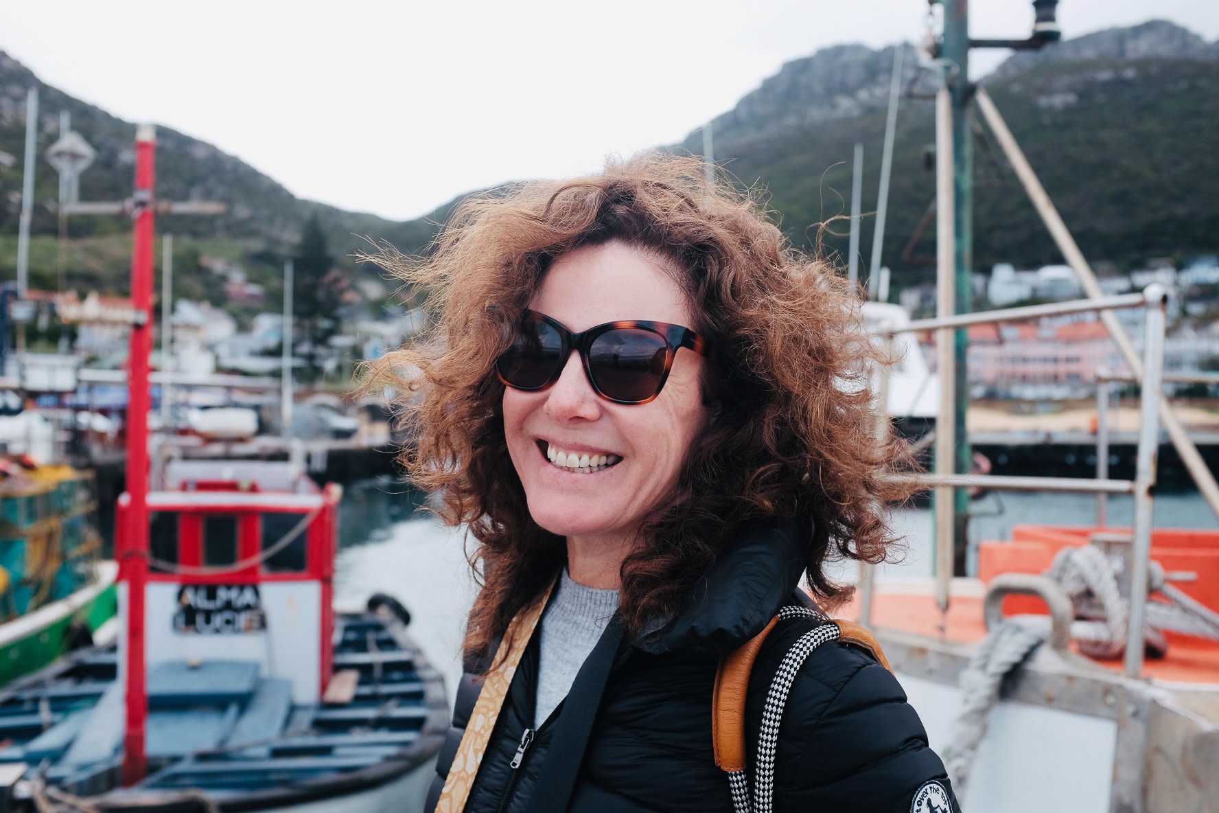 Windswept and laughing at the fishing harbour