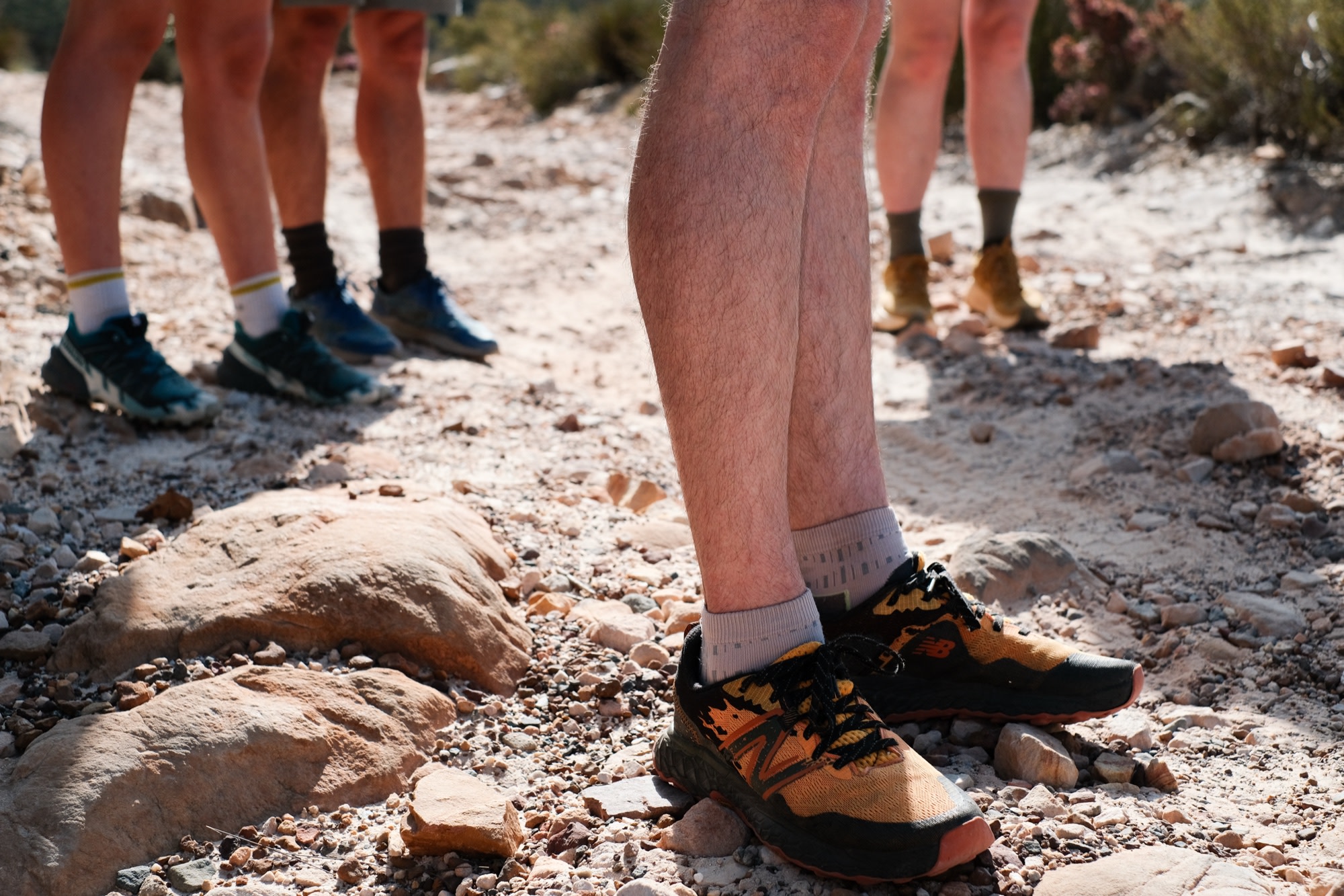New Balance trail shoes on a rocky path