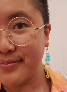 photo of customer wearing earrings