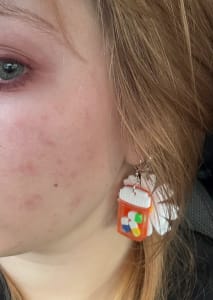 photo of customer wearing earrings