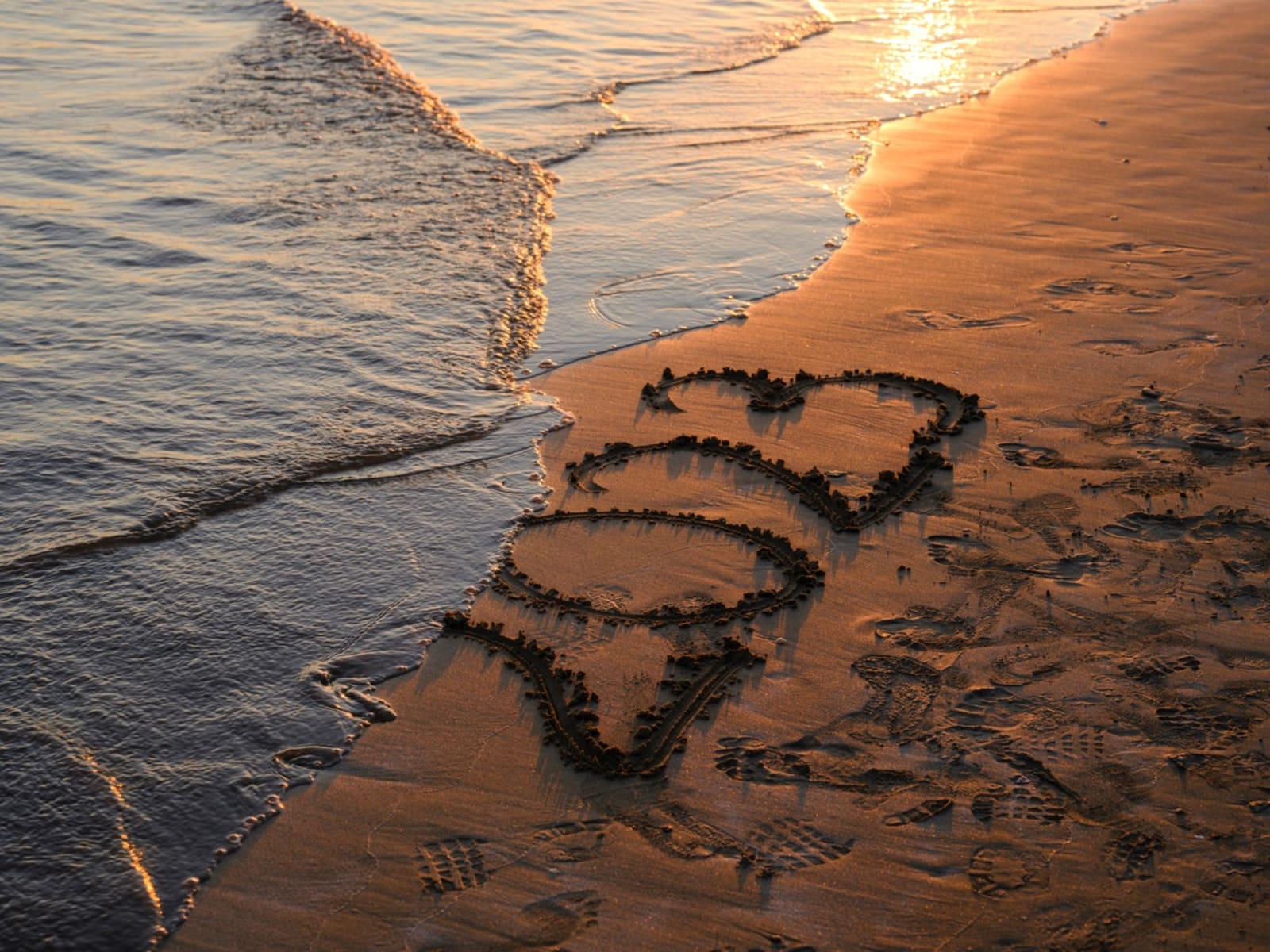2023 written on the beach sand