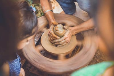 A potter making a clay pot