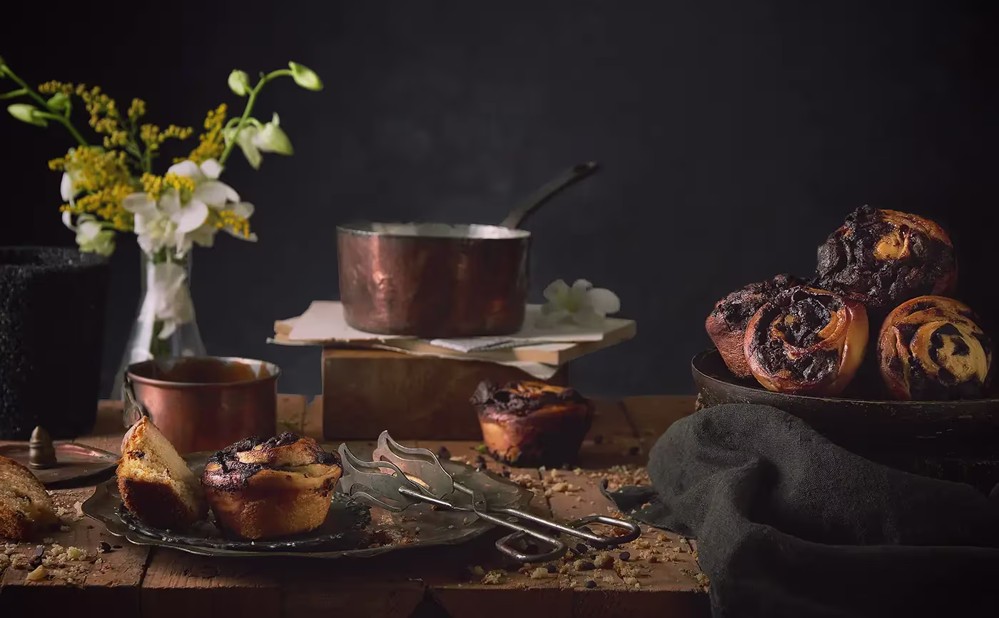 chocolate muffins on a vintage wooden table - dark moody lighting - food photography egypt - mohamed abdel-hady