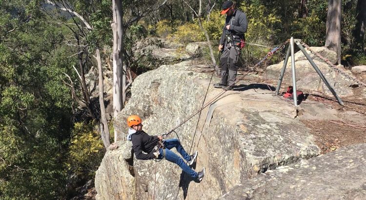 Abseiling down the first cliff