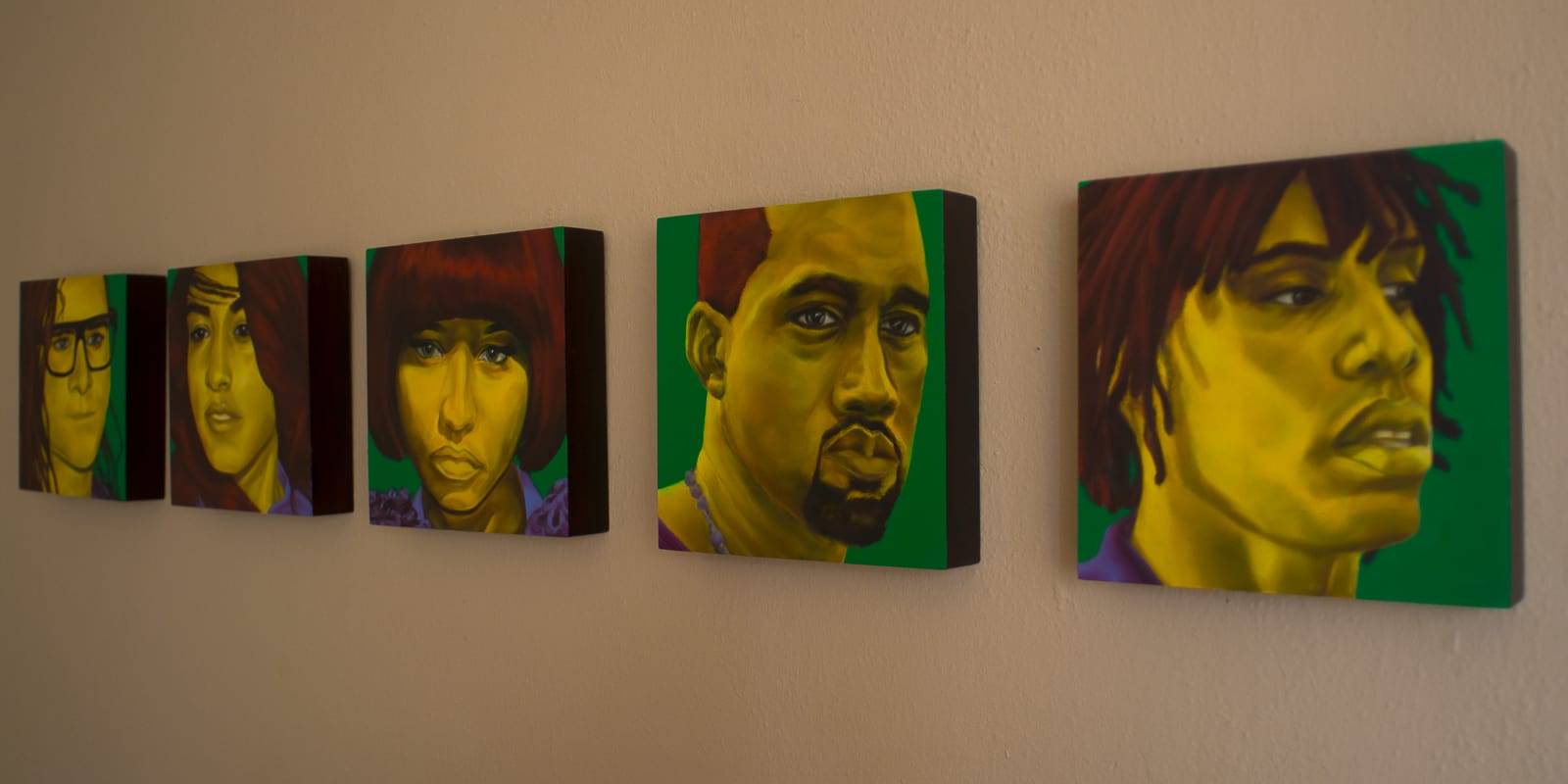 Paintings arranged on a wall