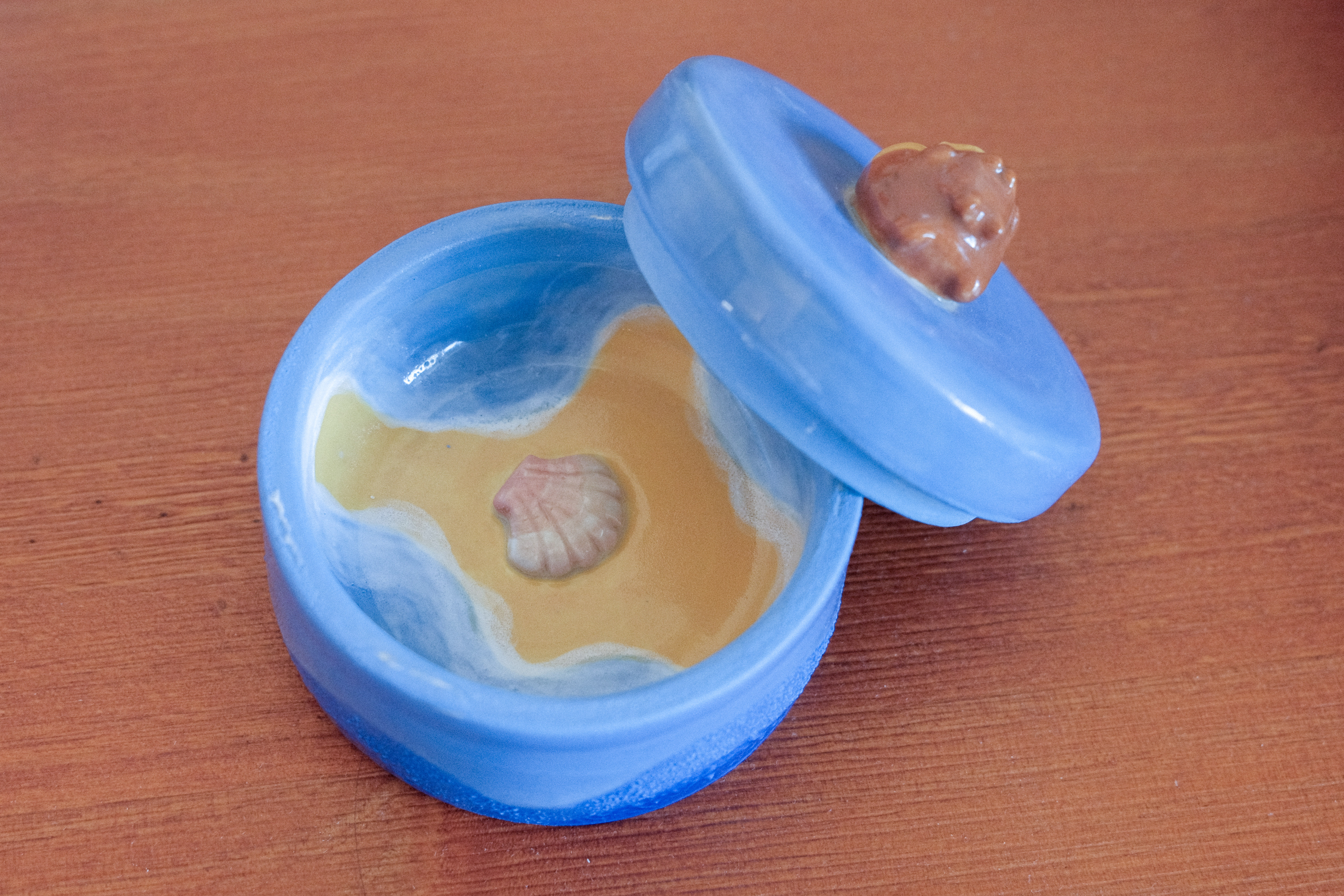 Cuddling otters inside jar