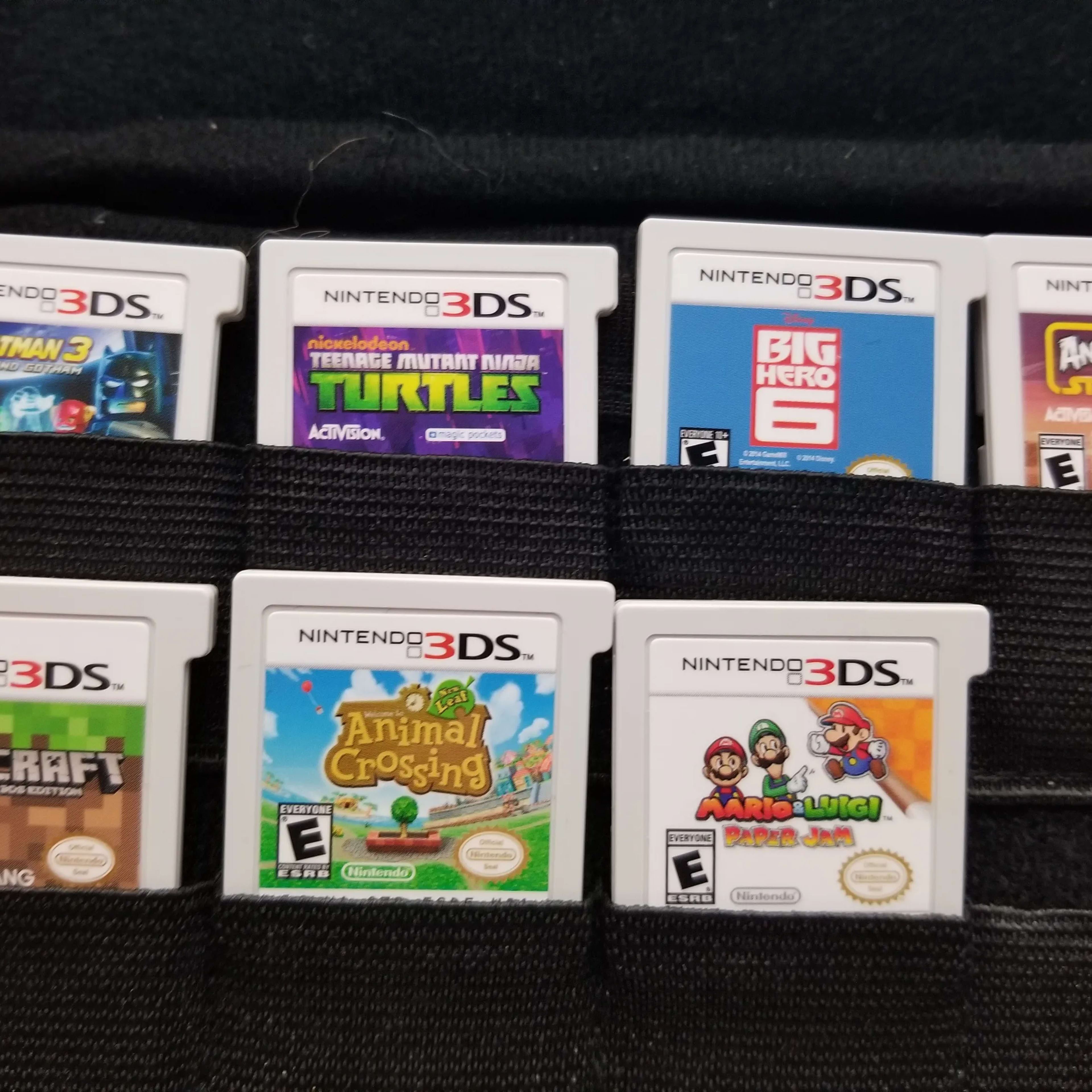 Nintendo New 3DS XL 4GB Handheld Gaming System W/ Pokémon carrying case and 7 games.