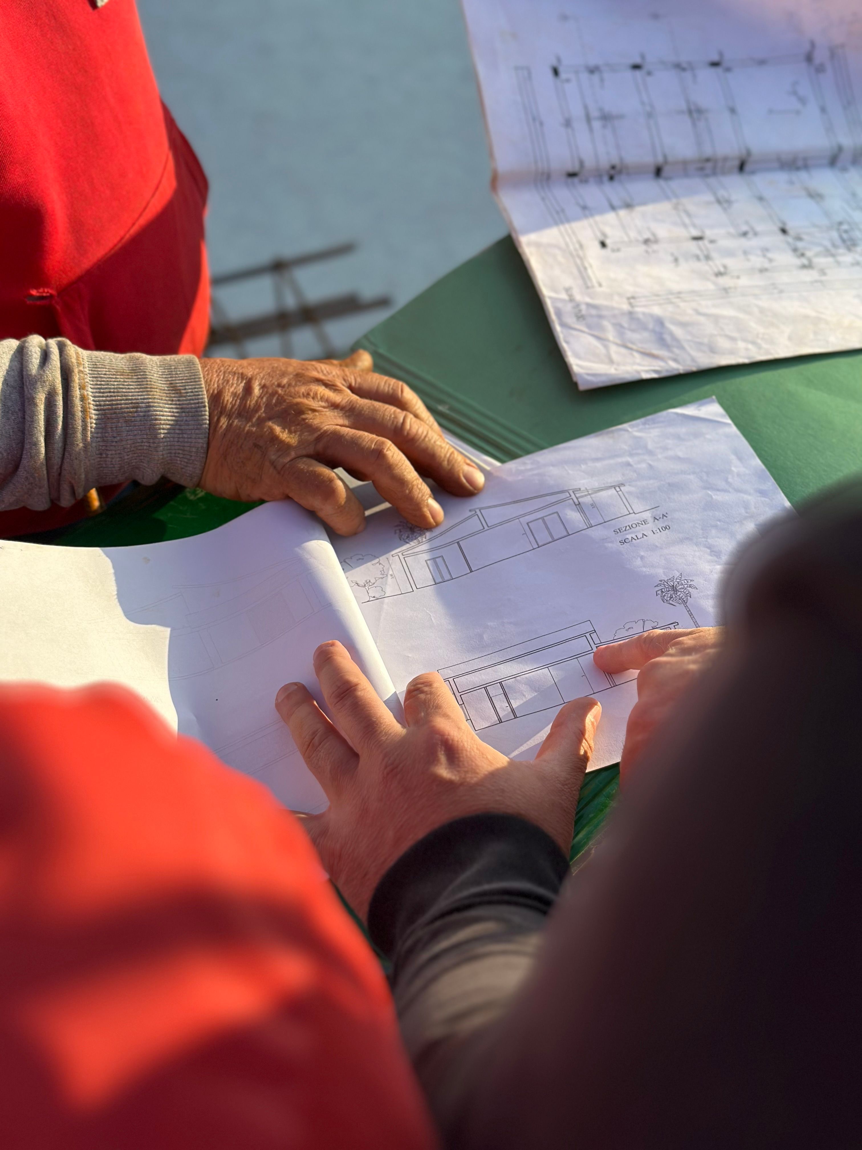 Engineers reviewing construction plans on site