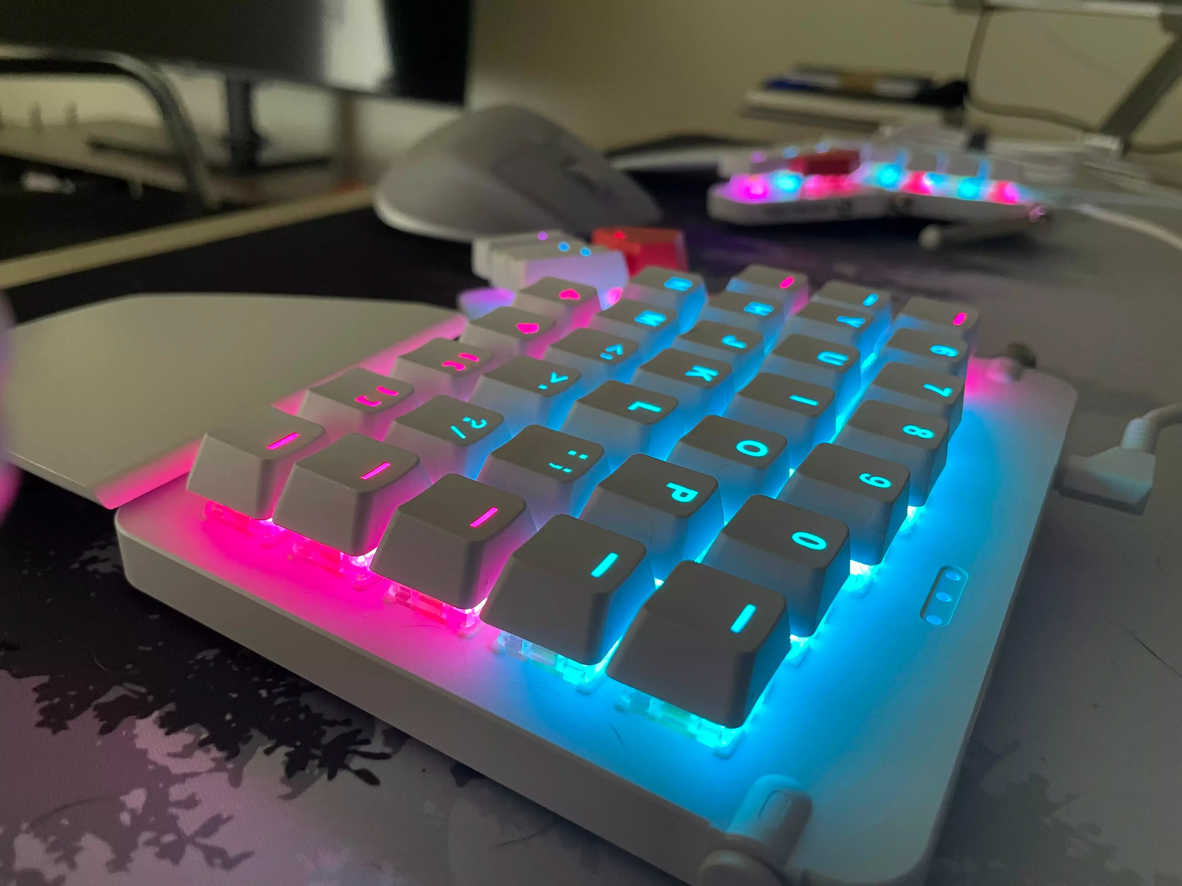 A closeup of the right hand wing of the Moonlander keyboard with the RGB all aglow