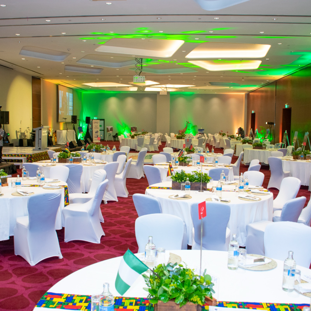 Fairy-lit corporate event under a stretch tent