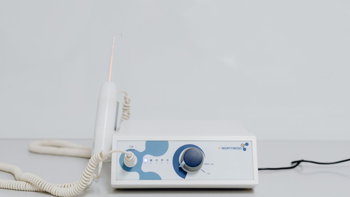 Photon Radiation Shows Better Survival Than Protons A high-tech ozone therapy device with a minimalistic design on a white background.