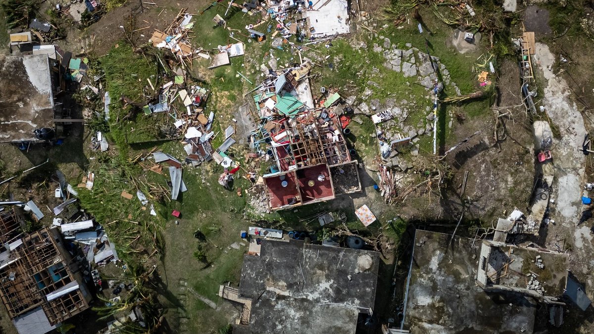 Aerial photograph showing severe structural damage after a hurricane.