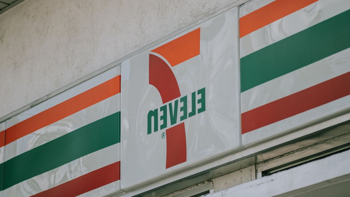 Close-up of a convenience store's iconic sign above the entrance.