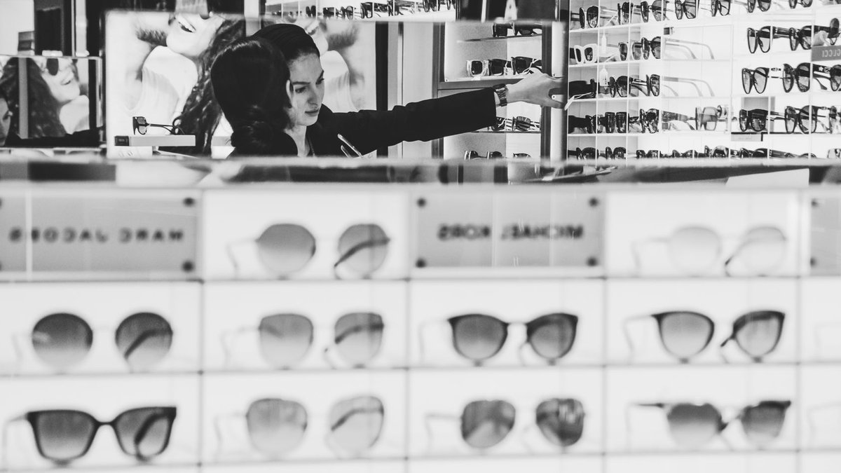 Argos boosts beauty product range Stylish eyewear shopping with a focus on designer brands in a modern store.