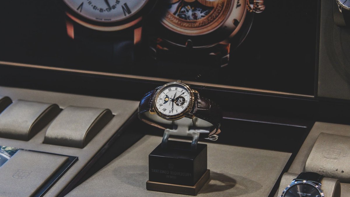 Elegant luxury wristwatches displayed in a sophisticated store with a focus on craftsmanship.