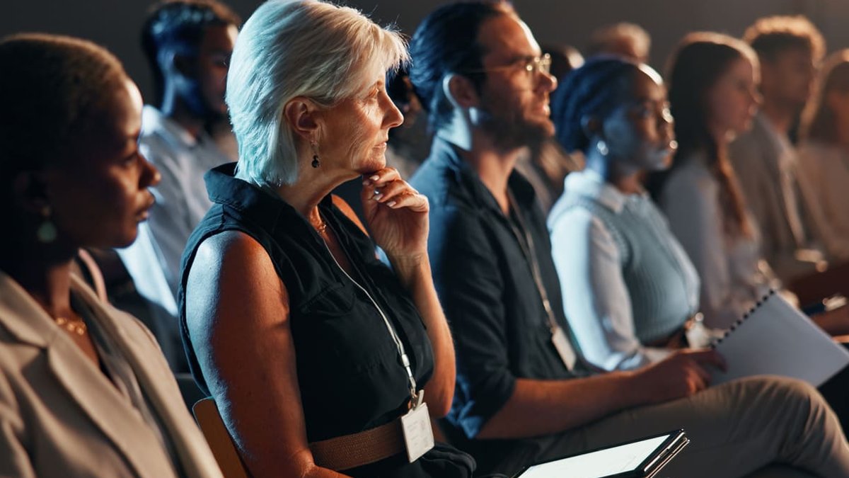 CFOs Tackle Tech, Strategy, and Uncertainty at Key Events Top CFO Conferences - business people at conference.
