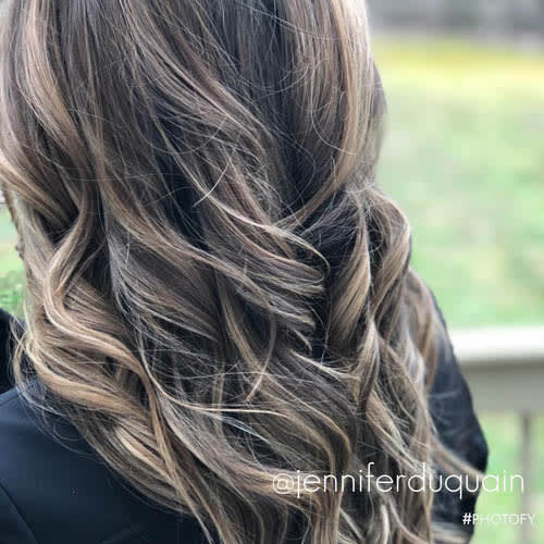 side-back view of girl with balayage hairstyle