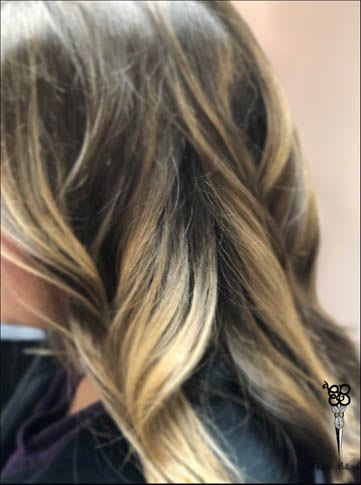 girl with grow out balayage hair style