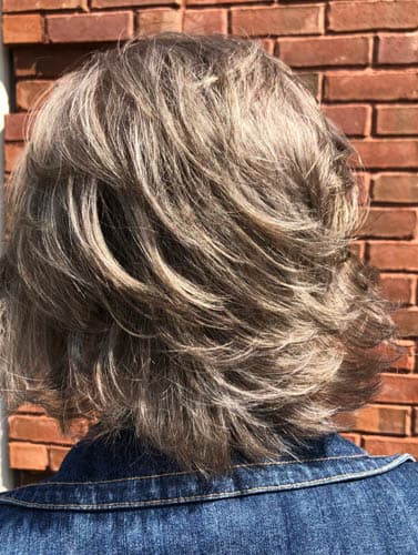 back view of girl with short length haircut
