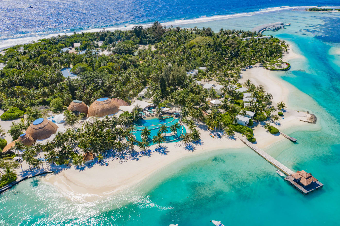 Aerial view of Kandooma island in South Malé Atoll, with its beach, pool and jetty