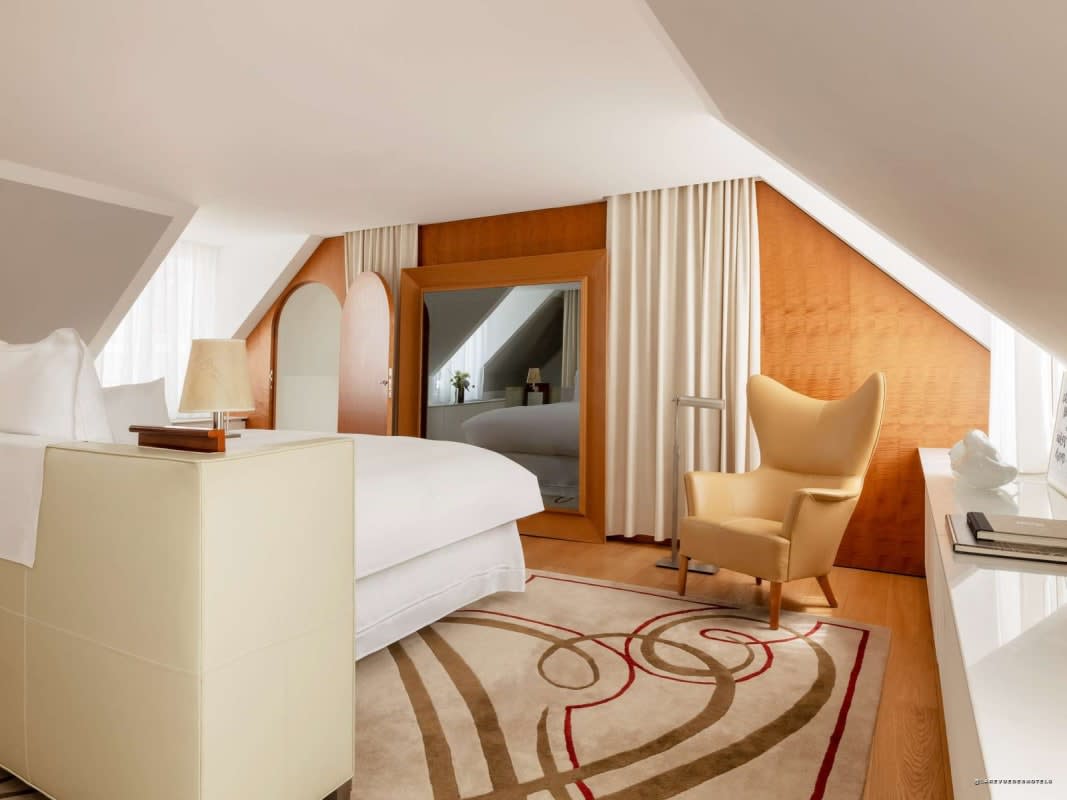 The bedroom of a top-floor mansard suite