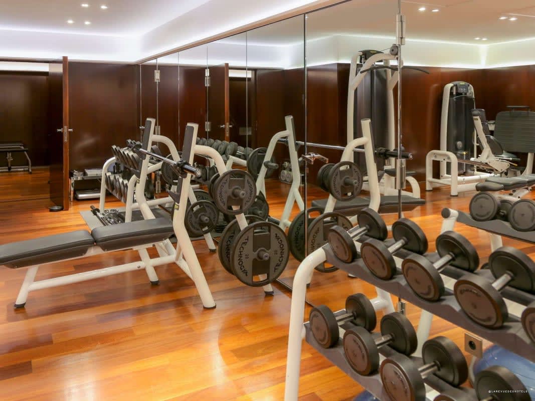 The hotel fitness room, featuring wood and mirrors