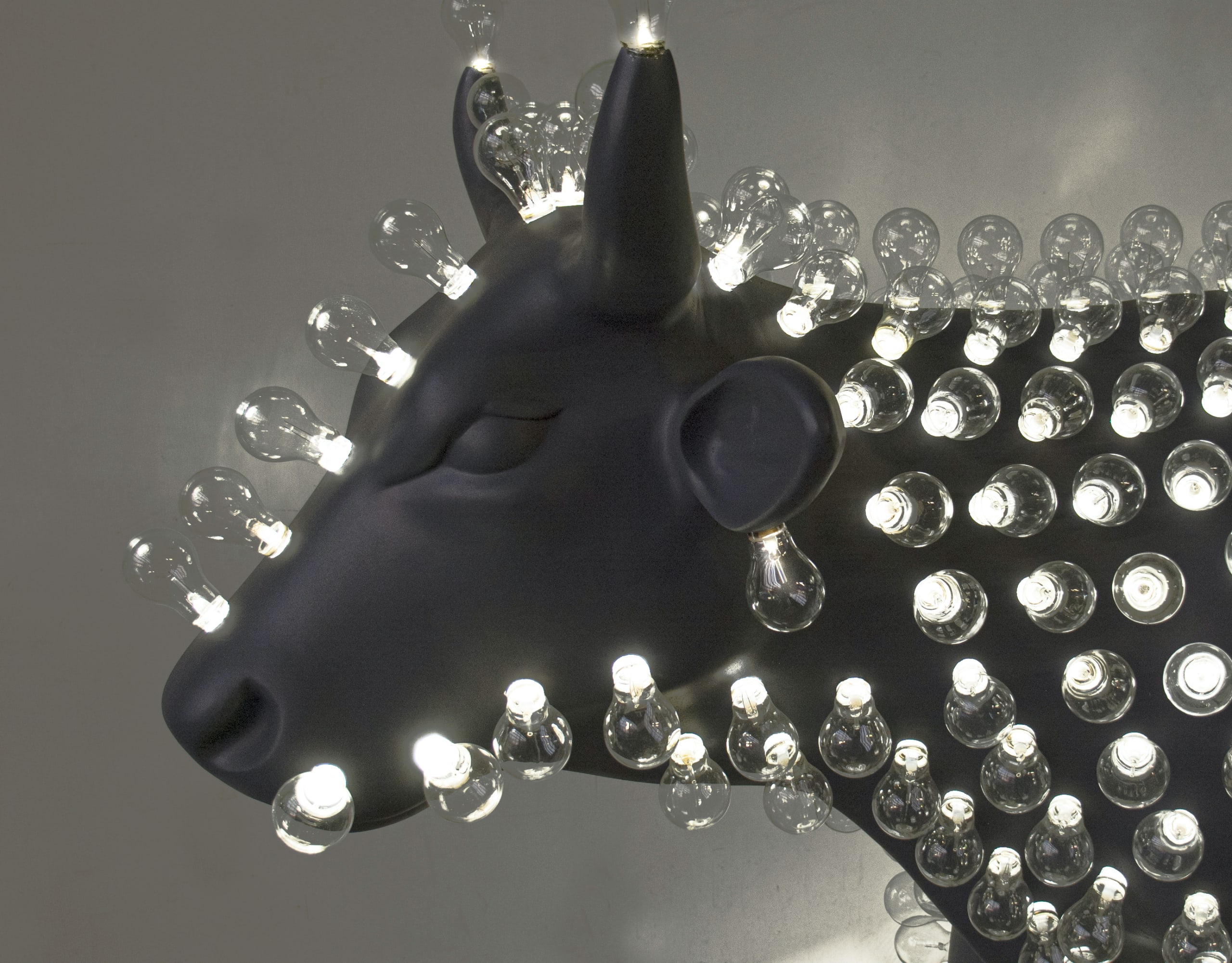 Close-up of Edison Cow’s hand-blown glass LED bulbs — intricate lighting modules in the interactive Edison series