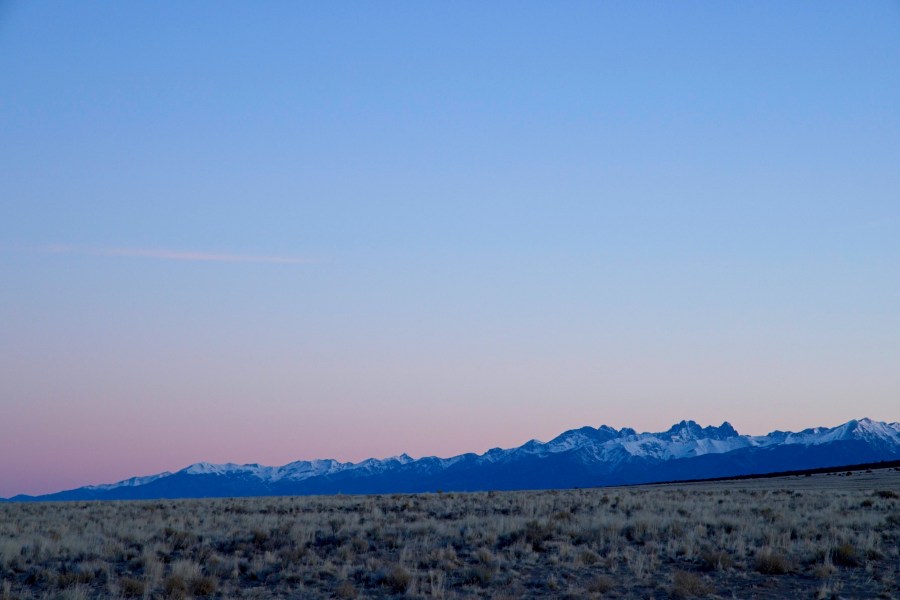 A colorful sunrise sky over the distant mountains