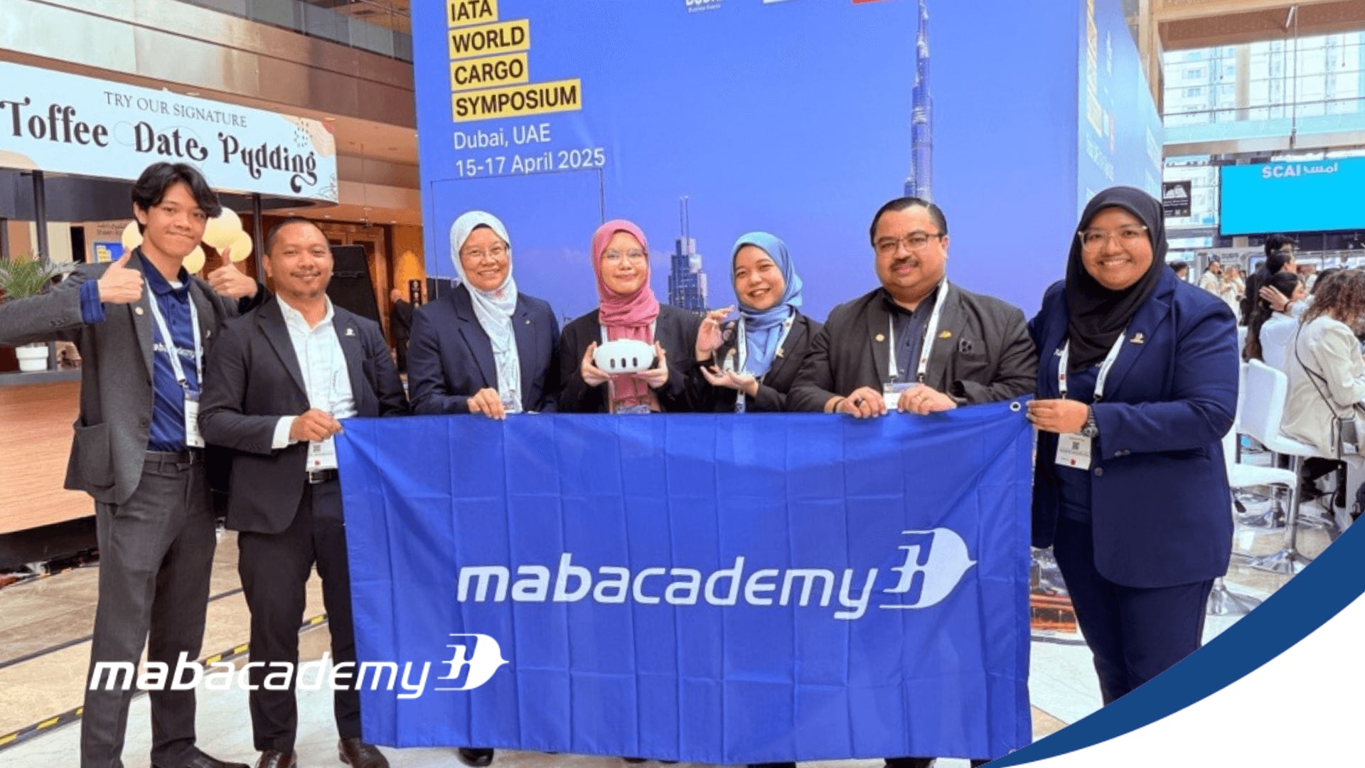 MAB Academy's team with a VR headset at the IATA World Cargo Symposium in Dubai, where the award was presented.