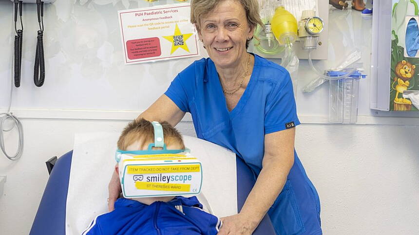 Child experiencing Smileyscope VR headset during a medical procedure at Portiuncula University Hospital