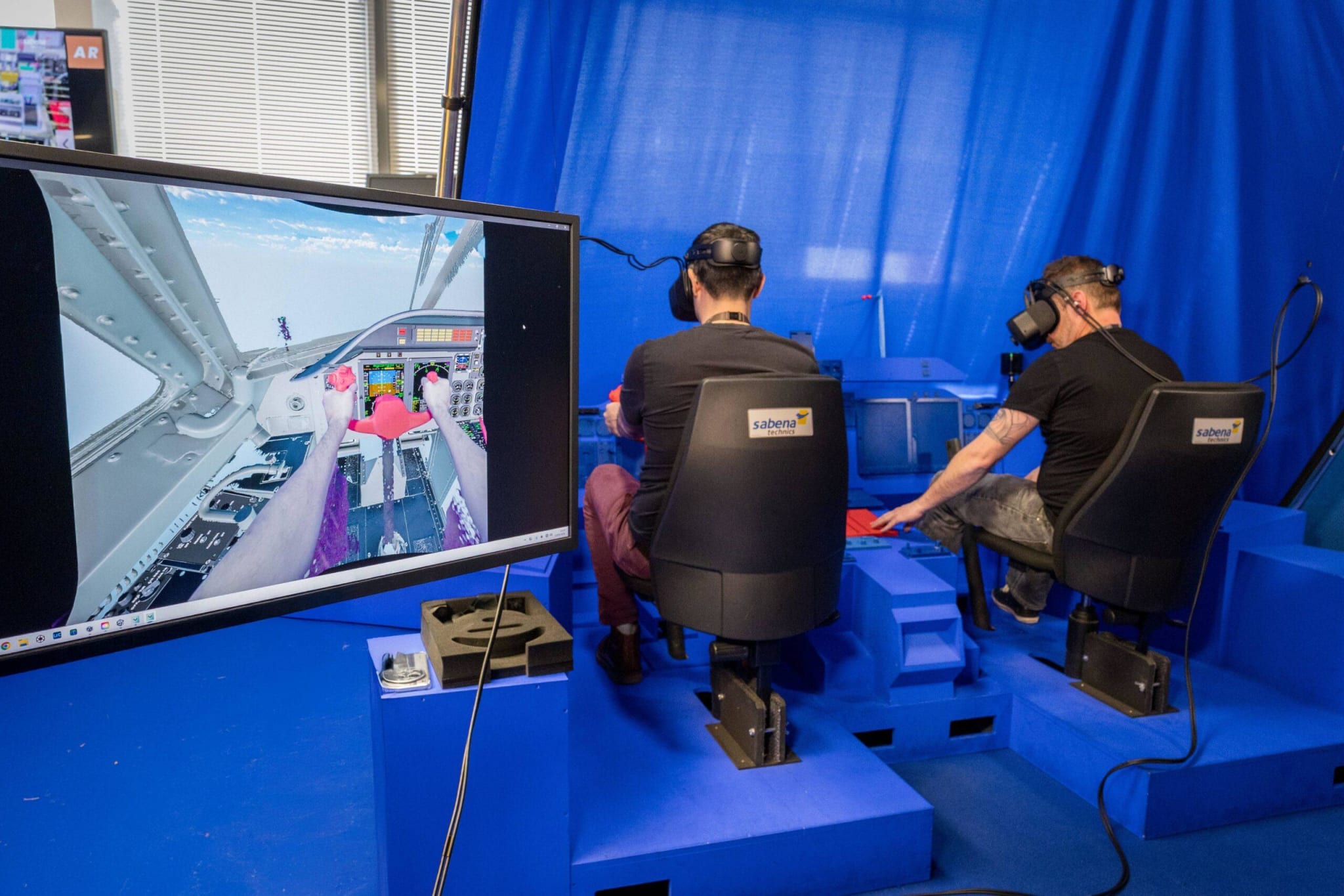Sabena Technics digital modelling team with mixed reality cockpit setup