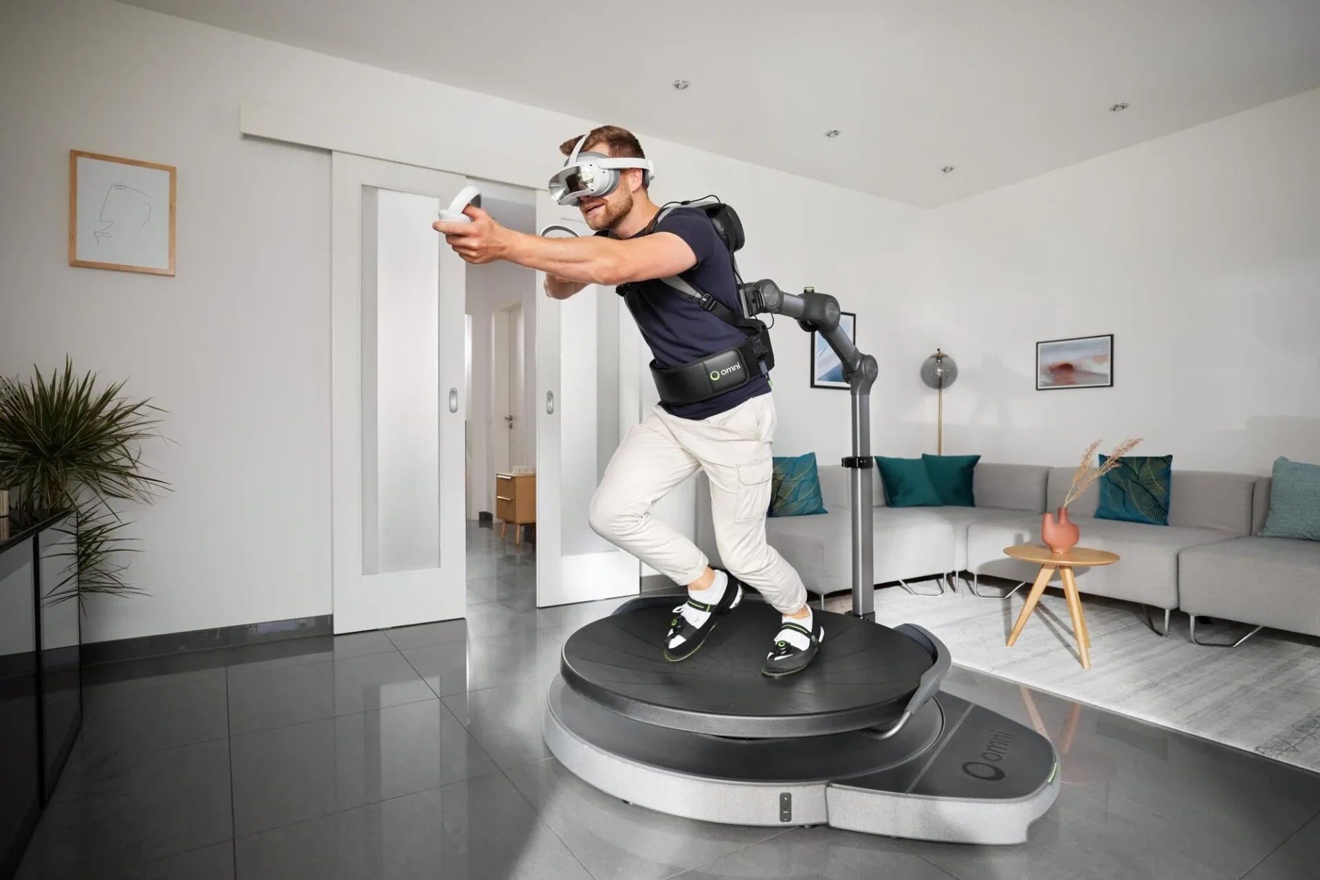 Tesla uses a VR treadmill to teleoperate and train Optimus humanoid robots
