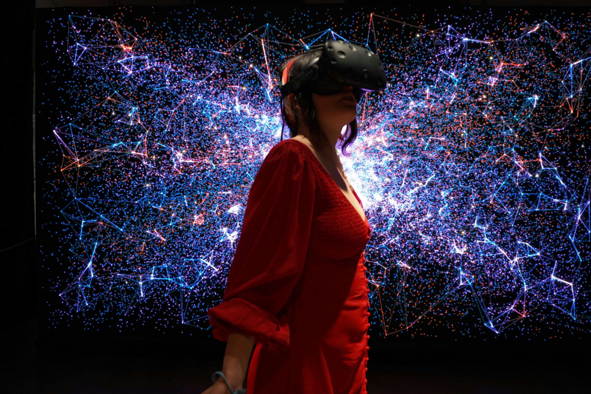 Person wearing a VR headset, photo by Sara Kurig on Unsplash