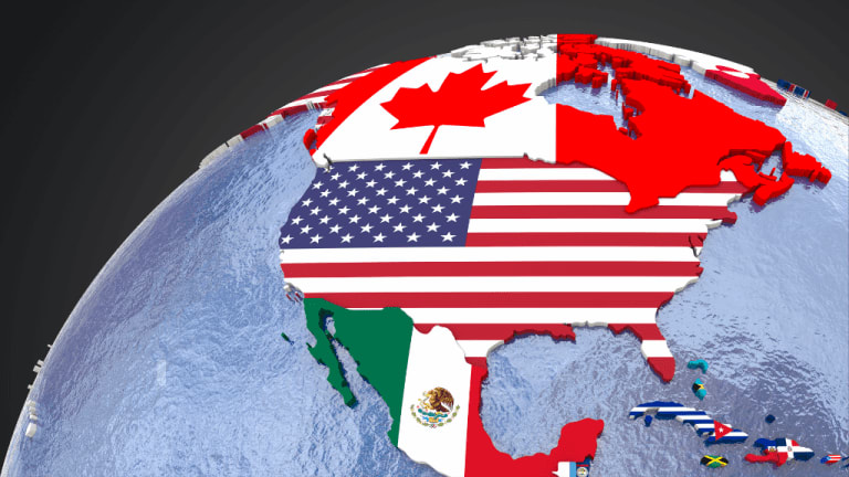 Flags of countries from North, Central, and South America flying together representing Pan American unity