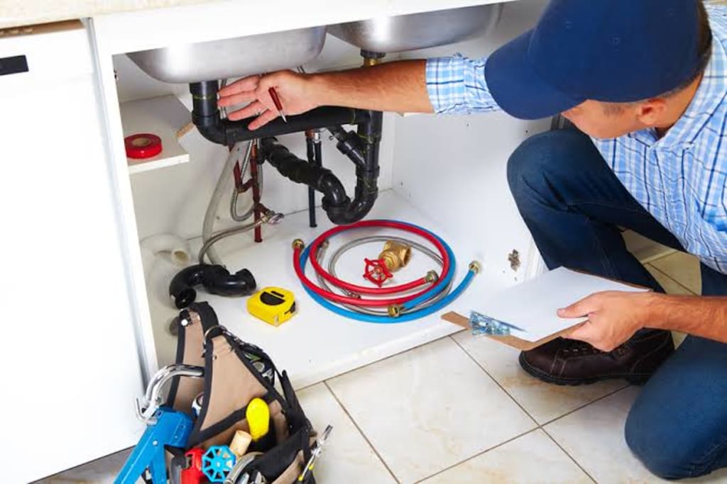 Professional plumber fixing pipes in Northridge CA