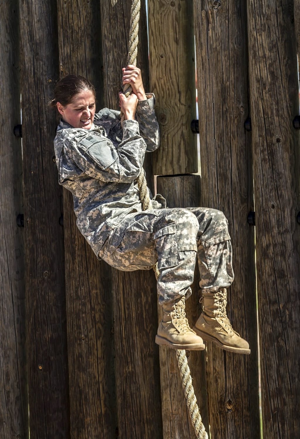 Female soldiers at basic combat training listen to instructions