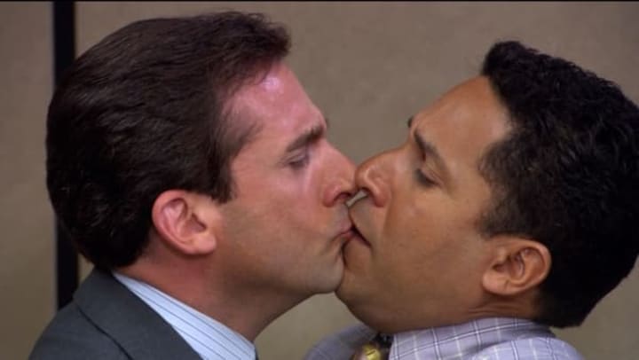 Michael Scott kissing Oscar Nunez
