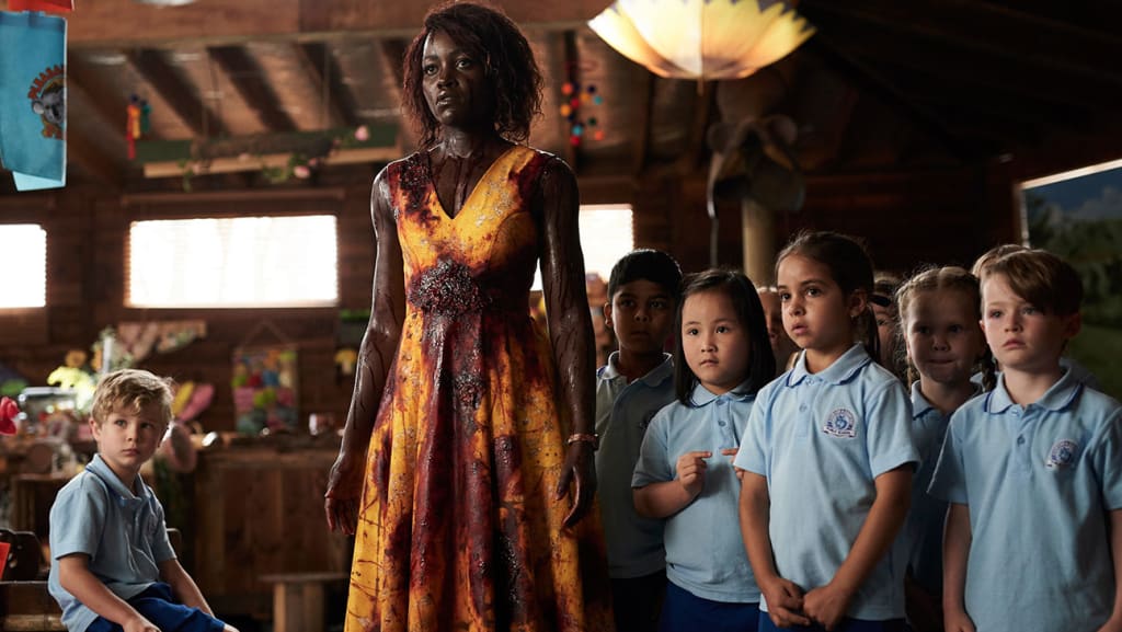 Lupita Nyong’o Has to Survive Zombies, Children, and Children Who Are Zombies in 'Little Monsters' Lupita Nyong’o Has to Survive Zombies, Children, and Children Who Are Zombies in 'Little Monsters'