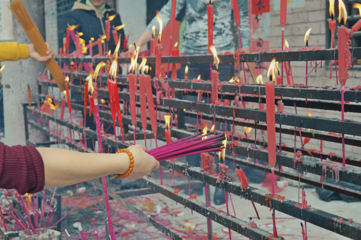 candles at a temple in shanghai