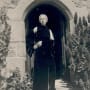 A person poses in the archway