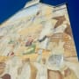 a decorative mural on a wall of a building
