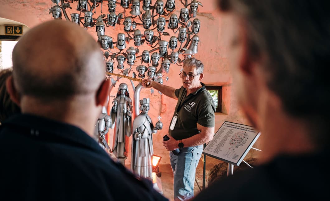 Mont Orgueil Castle volunteer shows off Tree of Succession exhibit