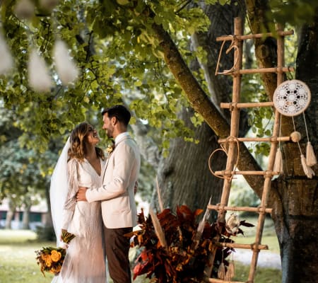 La Hougue Bie couple pose by decorated trees