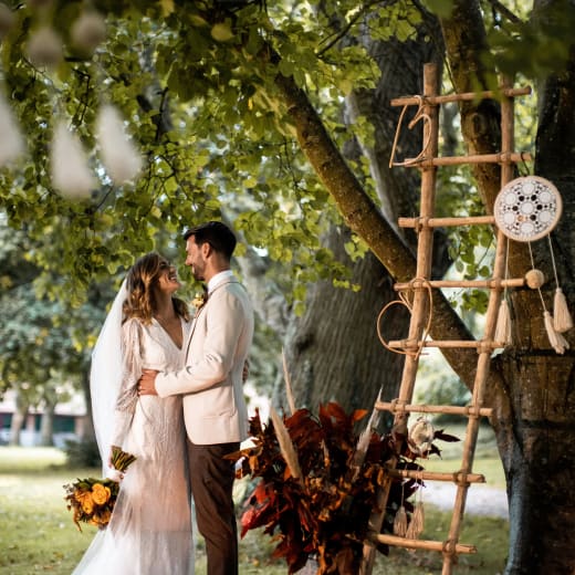 La Hougue Bie couple pose by decorated trees