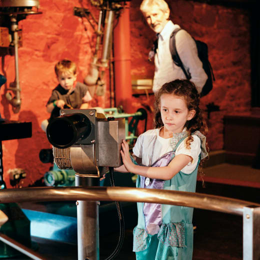 Maritime Museum girl plays with wind exhibit