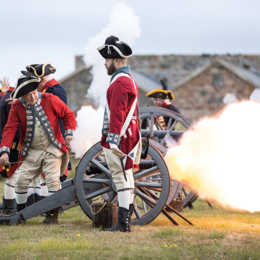 Men fire cannon dressed as 1781 Jersey Militia