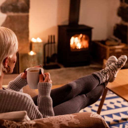 Woman relaxes with cup of tea