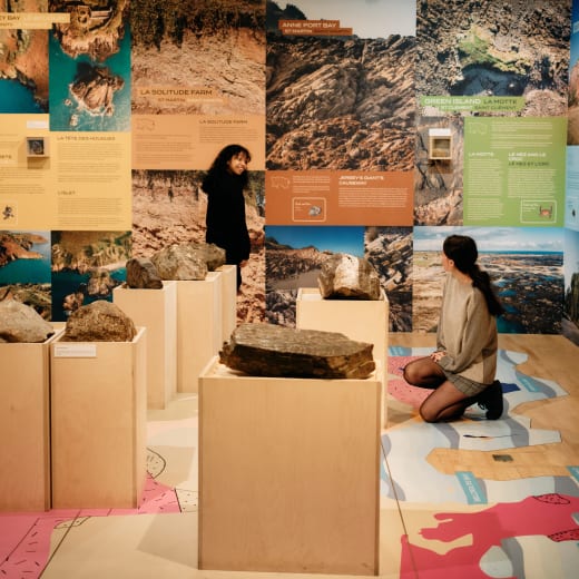 Two people look at exhibits